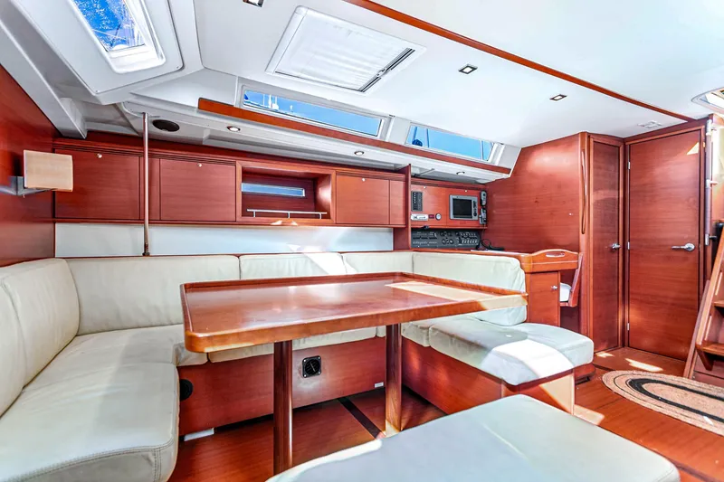 Slide: The Image of Luxurious interior of 2011 Dufour 525 Grand Large yacht with elegant wood finish. - 33