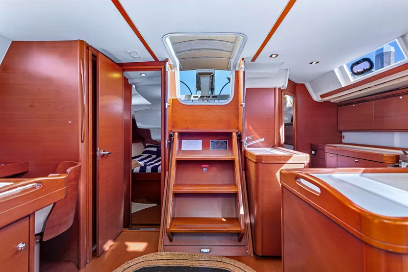Slide: The Image of Interior of 2011 Dufour 525 Grand Large yacht, featuring elegant wood finishes and modern design. - 38