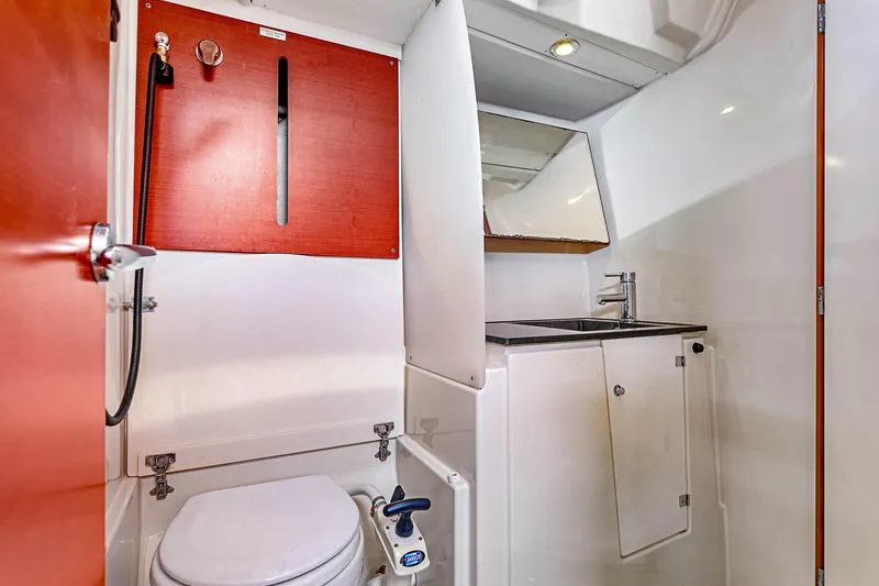 Slide: The Image of Bathroom interior of 2011 Dufour 525 Grand Large yacht, featuring toilet and sink. - 41