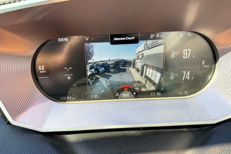 Slide: The Image of 2021 MasterCraft X26 dashboard display showing speed, temperature, and rearview camera. - 13