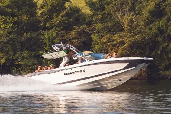 Slide: The Image of Manufacturer Provided Image: 2021 MasterCraft X26 boat cruising on a lake with passengers. - 28