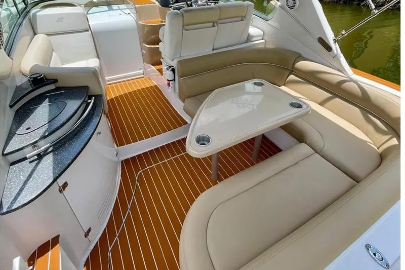 Slide: The Image of Interior of a 2007 Four Winns V338 yacht with seating area. - 5