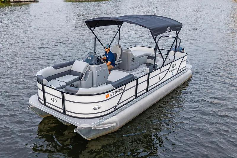 Slide: The Image of 2023 Veranda Relax VR22RFL pontoon boat on water, featuring sleek design and comfortable seating. - 15