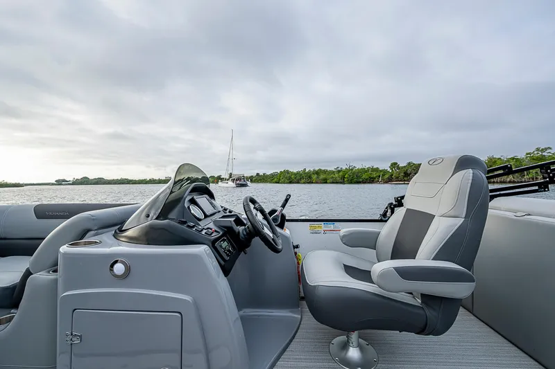 Slide: The Image of 2023 Veranda Relax VR22RFL boat interior with steering console and comfortable seating. - 9