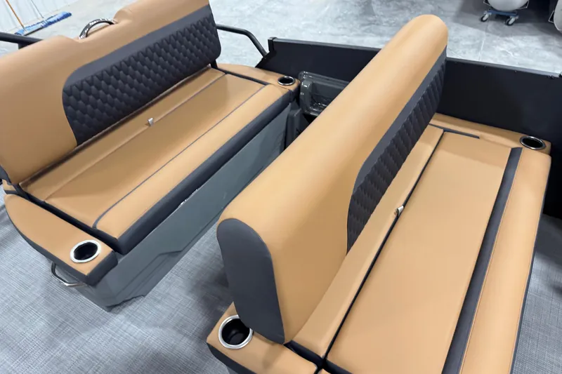 Slide: The Image of 2026 Sylvan L-5 boat seats with tan and black upholstery, featuring cup holders. - 12