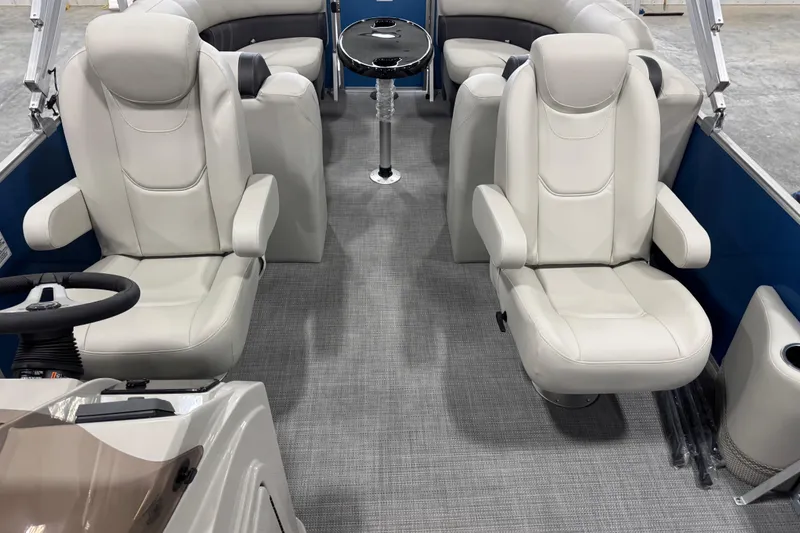 Slide: The Image of 2025 Sylvan 8522 Mirage boat interior with plush seating and modern design. - 12