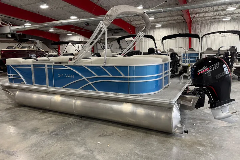 Slide: The Image of 2025 Sylvan 8522 Mirage pontoon boat with blue exterior and Mercury Pro XS engine. - 4