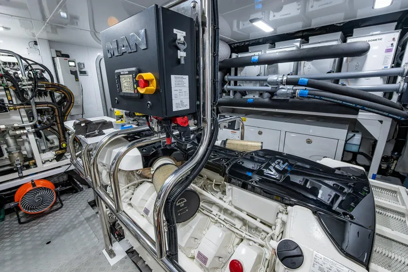 Slide: The Image of Engine room of 2022 Princess X95 yacht featuring MAN V12 engine components. - 102