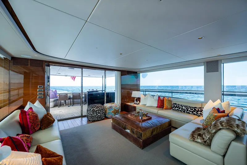 Slide: The Image of Luxurious 2022 Princess X95 yacht interior with plush seating and ocean view. - 12