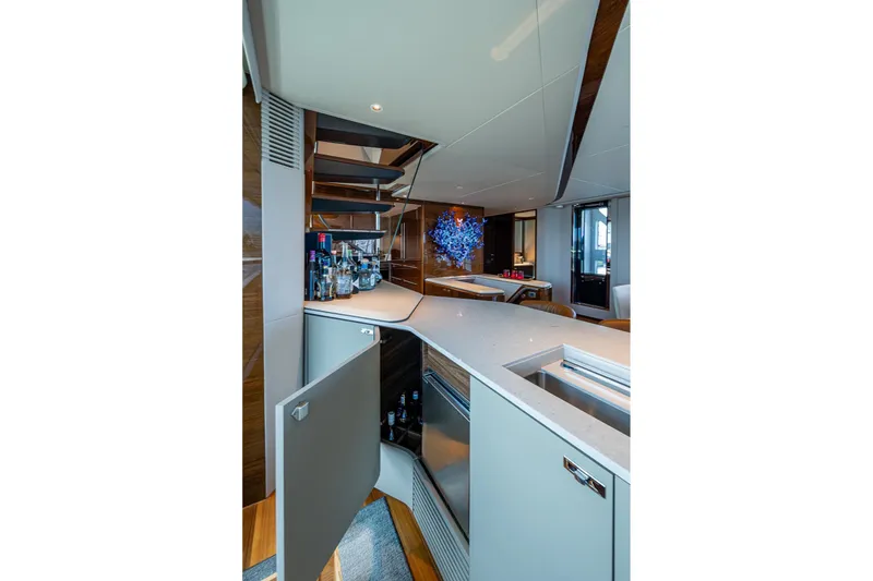 Slide: The Image of Luxurious interior of 2022 Princess X95 yacht featuring a modern bar area. - 21