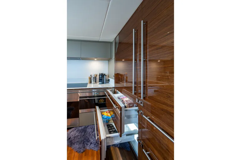 Slide: The Image of Luxurious kitchen interior of 2022 Princess X95 yacht with sleek cabinetry and modern appliances. - 27