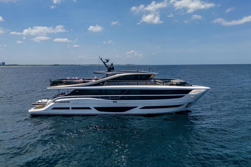 Slide: The Image of Luxury 2022 Princess X95 yacht cruising on open sea under clear skies. - 3