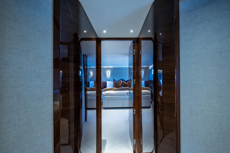 Slide: The Image of Luxurious interior of 2022 Princess X95 yacht, featuring elegant wood finishes and modern design. - 41