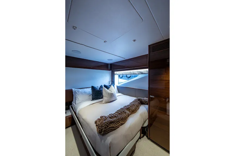 Slide: The Image of Luxurious bedroom interior of 2022 Princess X95 yacht with elegant bedding and modern design. - 50