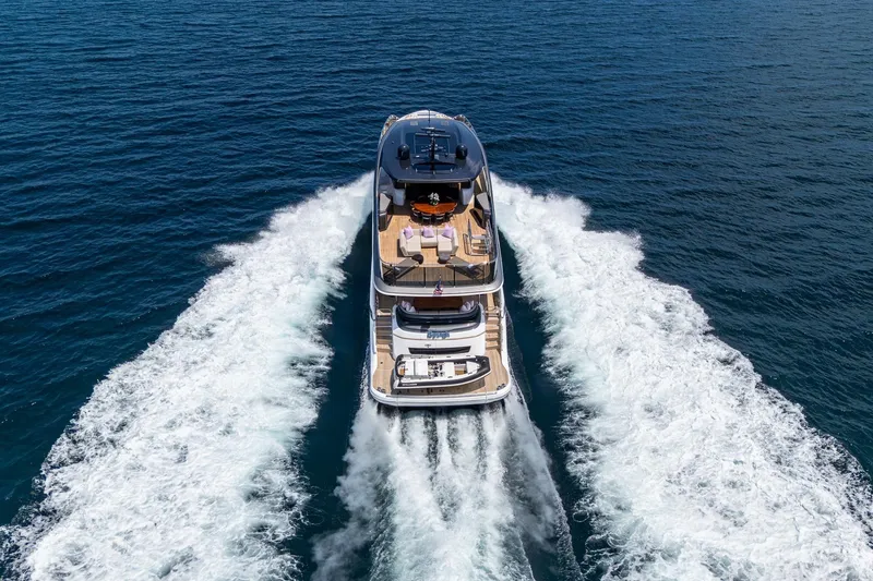 Slide: The Image of Luxury 2022 Princess X95 yacht cruising on open sea, aerial rear view. - 6