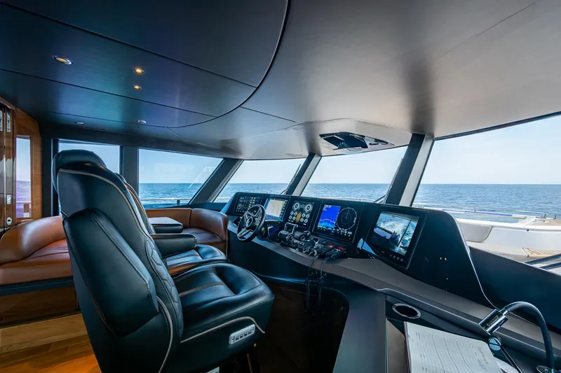 Slide: The Image of Luxurious 2022 Princess X95 yacht cockpit with advanced navigation systems and ocean view. - 62