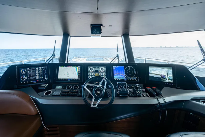 Slide: The Image of Cockpit of 2022 Princess X95 yacht with advanced navigation systems and ocean view. - 64