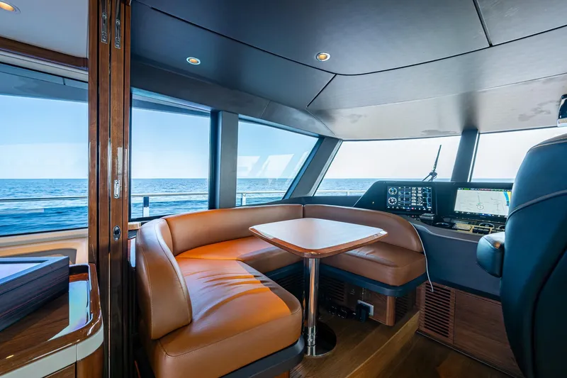 Slide: The Image of Luxurious 2022 Princess X95 yacht interior with leather seating and ocean view. - 65