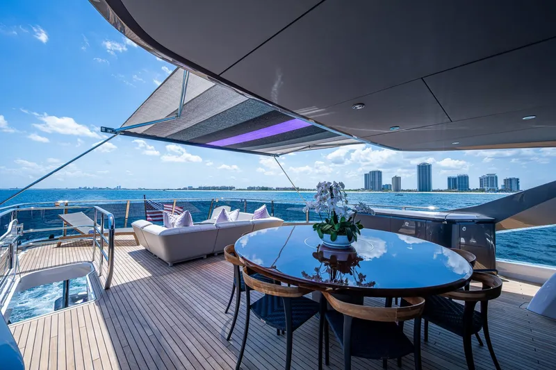 Slide: The Image of Luxurious 2022 Princess X95 yacht deck with ocean view, elegant seating, and dining area. - 71