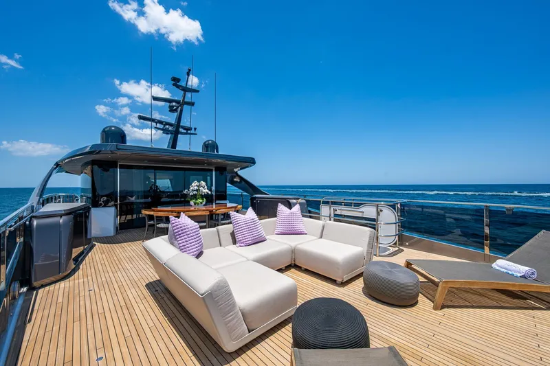 Slide: The Image of Luxurious 2022 Princess X95 yacht deck with modern seating and ocean view. - 74