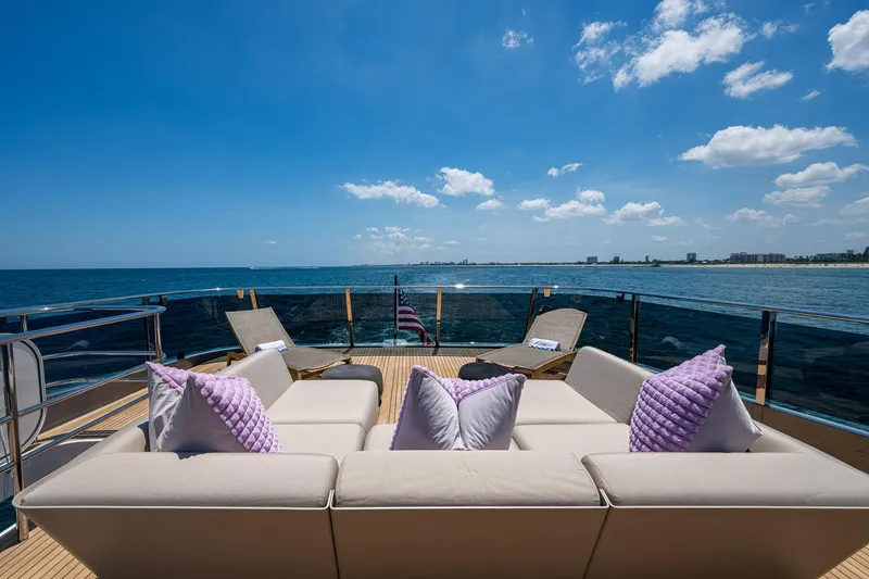 Slide: The Image of Luxurious 2022 Princess X95 yacht deck with plush seating, ocean view, and clear blue sky. - 76