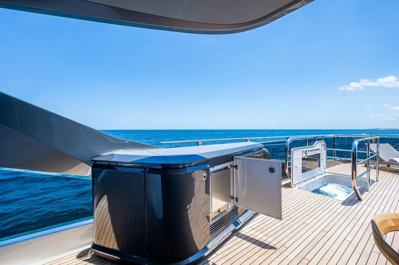 Slide: The Image of Luxurious 2022 Princess X95 yacht deck with ocean view and open storage. - 78
