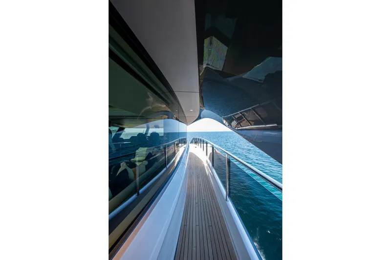 Slide: The Image of Side deck view of 2022 Princess X95 yacht cruising on open sea. - 79