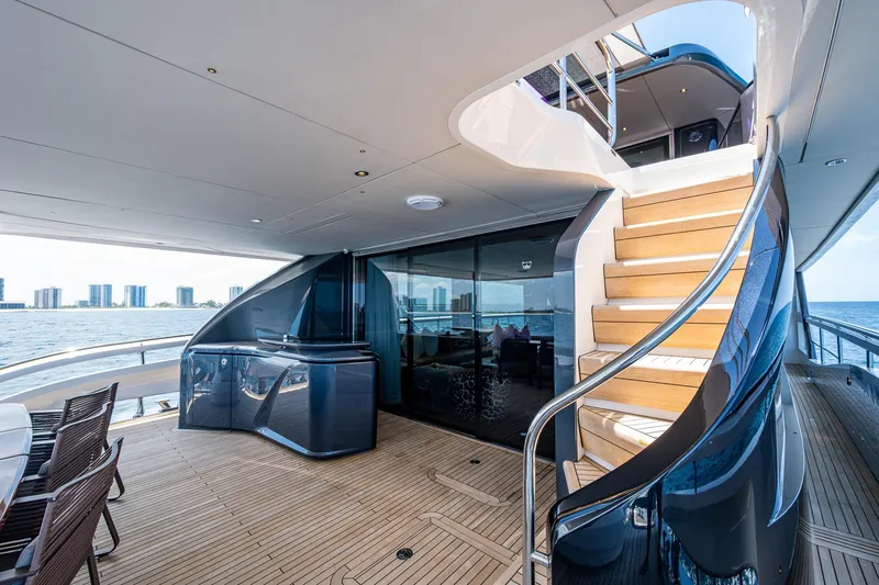 Slide: The Image of Luxurious 2022 Princess X95 yacht deck with elegant staircase and ocean view. - 88