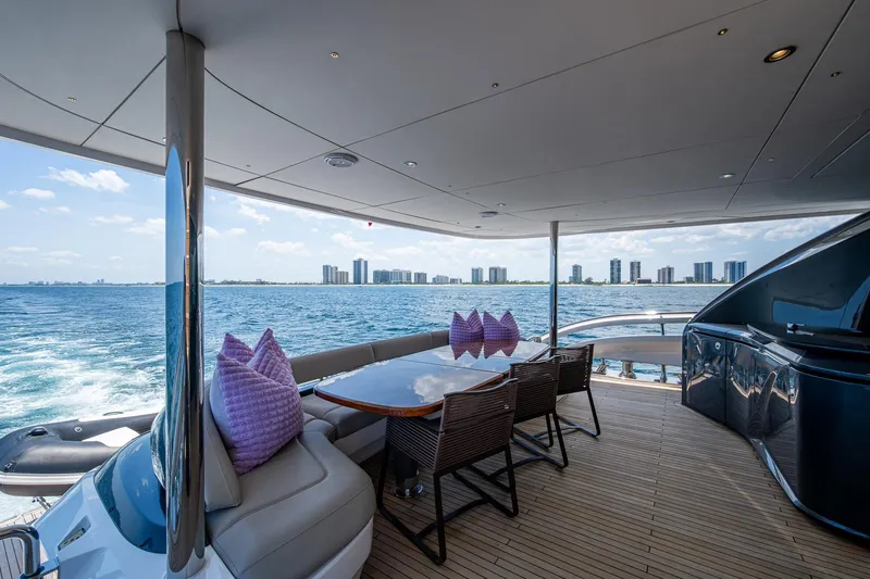 Slide: The Image of Luxurious 2022 Princess X95 yacht deck with ocean view and city skyline. - 92