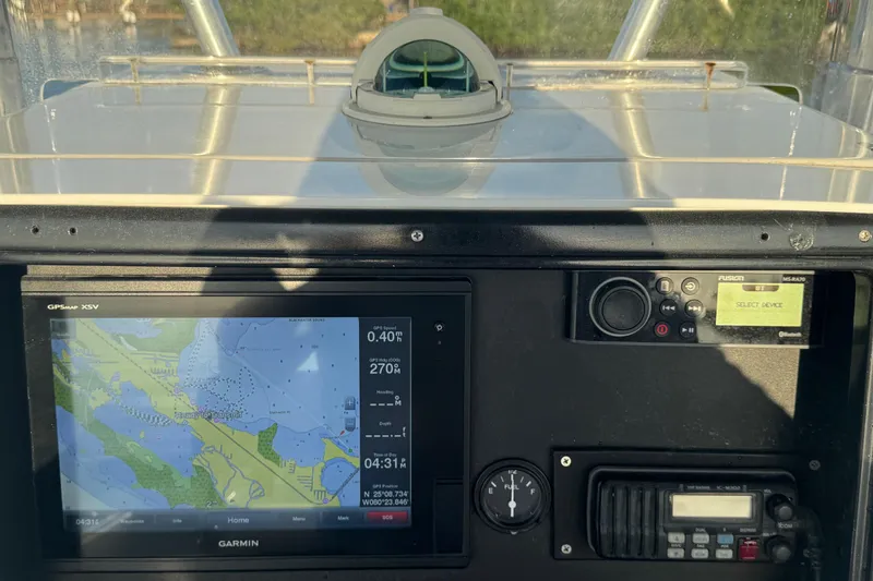 Slide: The Image of Dashboard of a 1998 Contender 25 Open boat with navigation and communication equipment. - 8