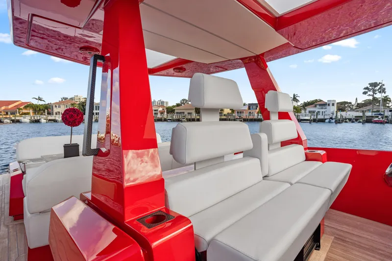 Slide: The Image of Red and white interior of 2021 Wally 48ft yacht with waterfront view. - 11