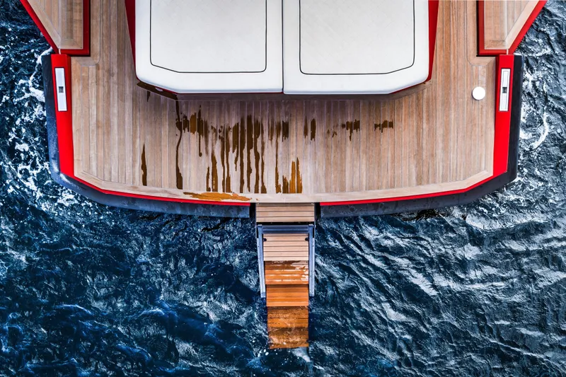 Slide: The Image of Top view of 2021 Wally 48ft yacht with wooden deck and ocean backdrop. - 14