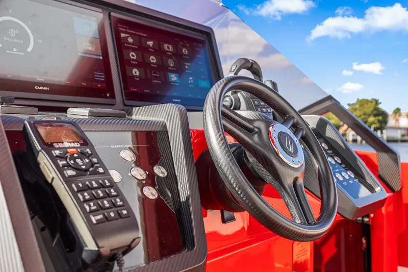 Slide: The Image of Cockpit of 2021 Wally 48ft yacht with advanced navigation systems and steering wheel. - 18
