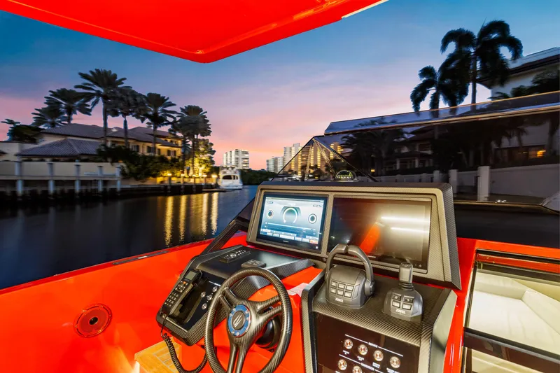 Slide: The Image of Interior view of 2021 Wally 48ft yacht with modern dashboard at sunset. - 26