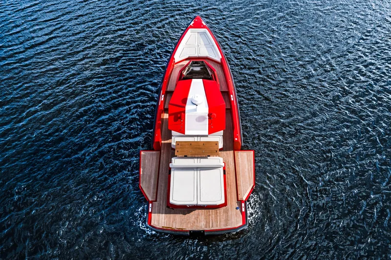 Slide: The Image of Red 2021 Wally 48ft yacht on water, aerial view, showcasing sleek design. - 4