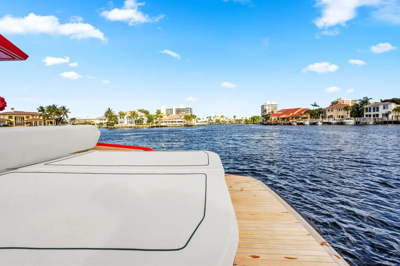 Slide: The Image of Luxurious 2021 Wally 48ft yacht on serene waterfront with clear blue skies. - 9