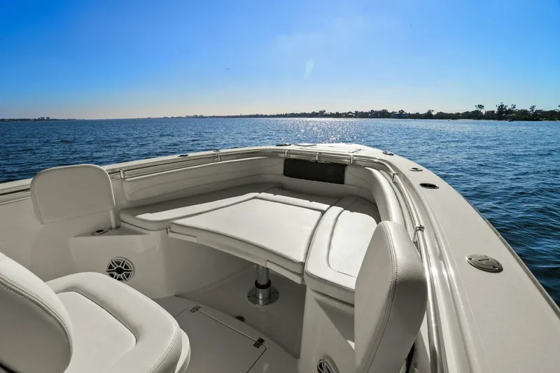 Slide: The Image of 2023 Cobia 301 Center Console boat interior with ocean view. - 5