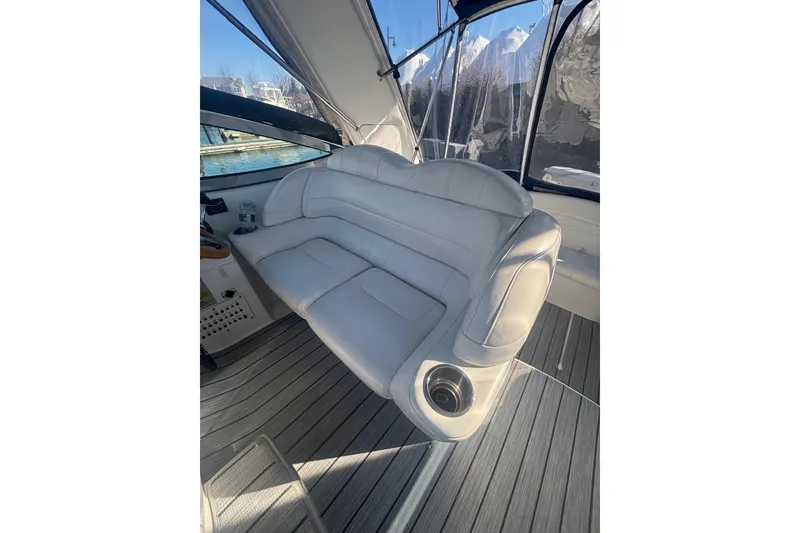 Slide: The Image of 2006 Formula 34 Performance Cruiser interior with white seating and wood flooring. - 17