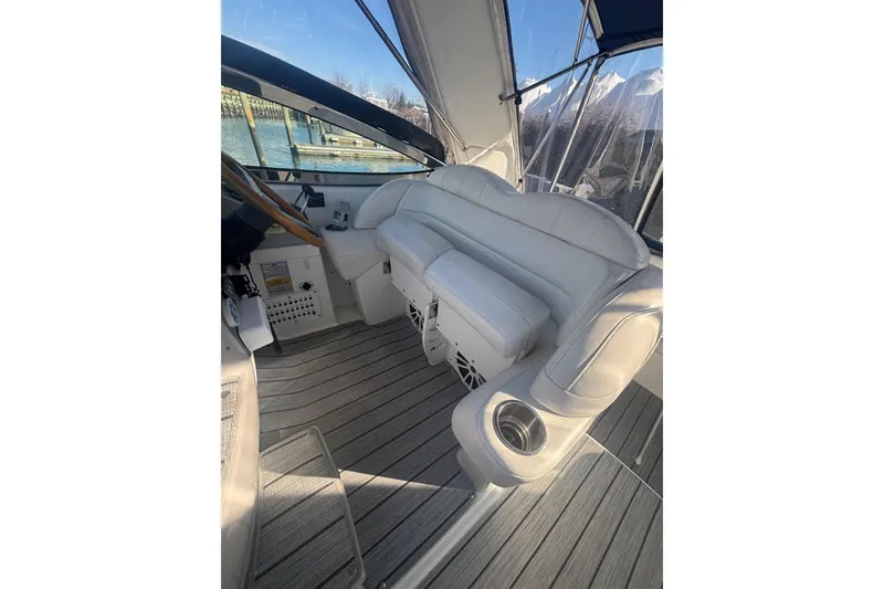 Slide: The Image of 2006 Formula 34 Performance Cruiser interior with white seating and wood flooring. - 18