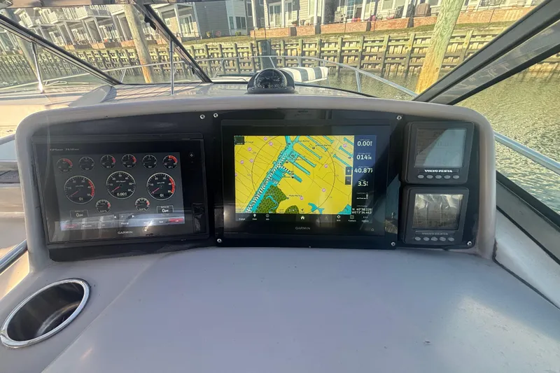 Slide: The Image of Helm of 2006 Formula 34 Performance Cruiser with wooden steering wheel and navigation display. - 22