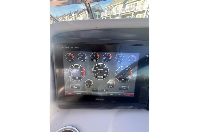 Slide: The Image of Dashboard of a 2006 Formula 34 Performance Cruiser with navigation and control displays. - 23