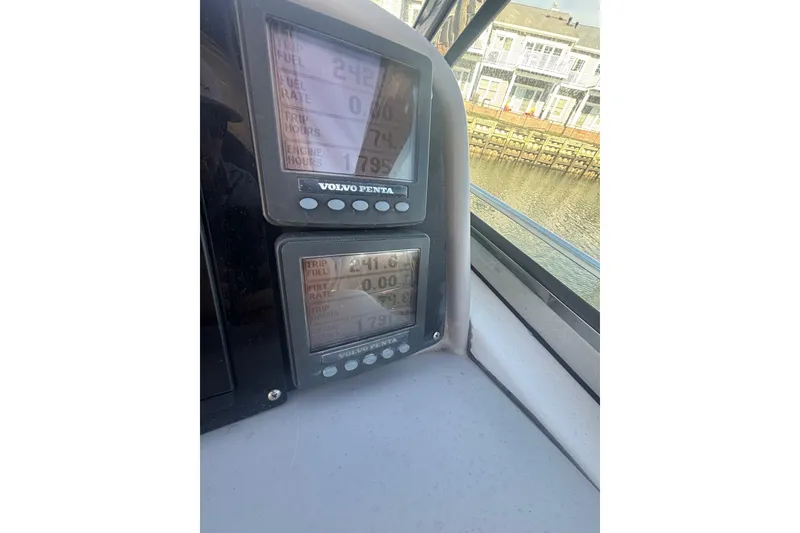 Slide: The Image of Control panel of a 2006 Formula 34 Performance Cruiser boat with switches and microphone. - 30