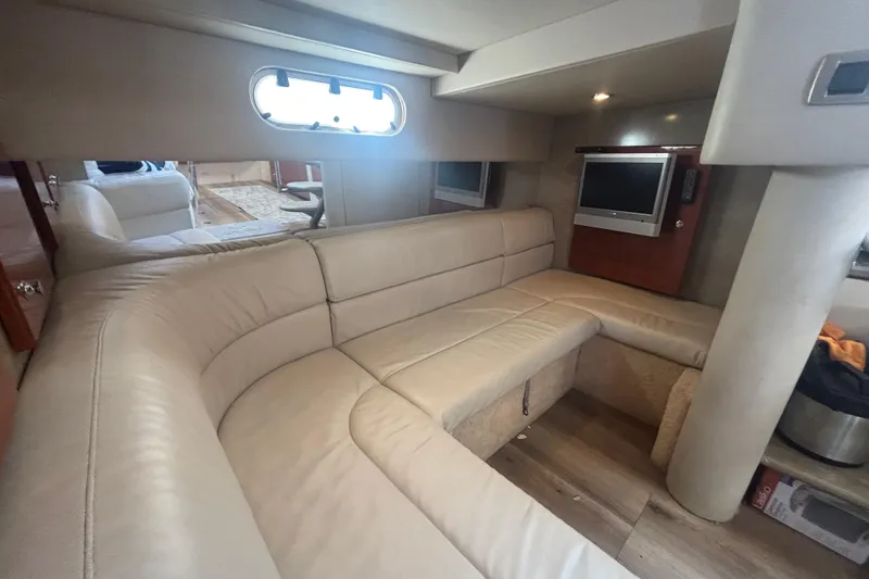 Slide: The Image of 2006 Formula 34 Performance Cruiser interior with beige leather seating and wood flooring. - 33