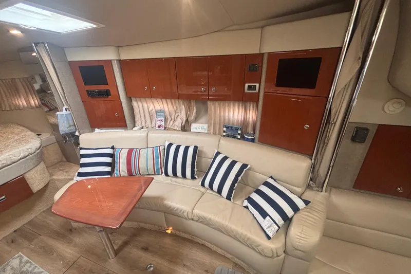 Slide: The Image of 2006 Formula 34 Performance Cruiser interior with cozy seating, striped pillows, and modern amenities. - 35