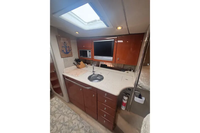 Slide: The Image of Interior of 2006 Formula 34 Performance Cruiser with modern kitchen and cozy seating area. - 40