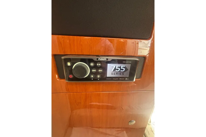 Slide: The Image of Control panel on 2006 Formula 34 Performance Cruiser, featuring ProMariner and AC settings. - 44