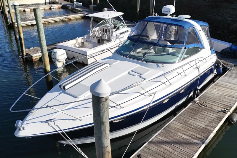 Slide: The Image of 2006 Formula 34 Performance Cruiser docked, featuring blue canopy and sleek design. - 5