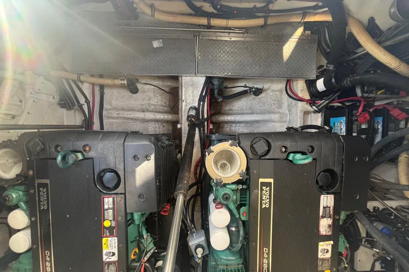 Slide: The Image of Engine room of a 2006 Formula 34 Performance Cruiser with visible wiring and equipment. - 51