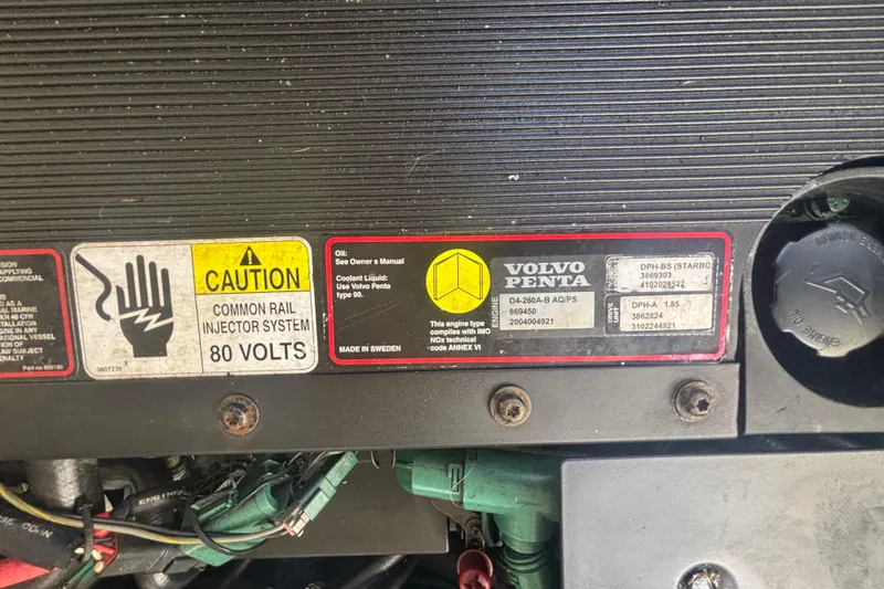 Slide: The Image of Engine compartment of a 2006 Formula 34 Performance Cruiser with fuel filters and hoses. - 54