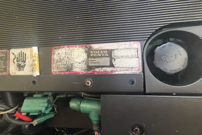 Slide: The Image of Volvo Penta engine label on 2006 Formula 34 Performance Cruiser, caution and specifications visible. - 55